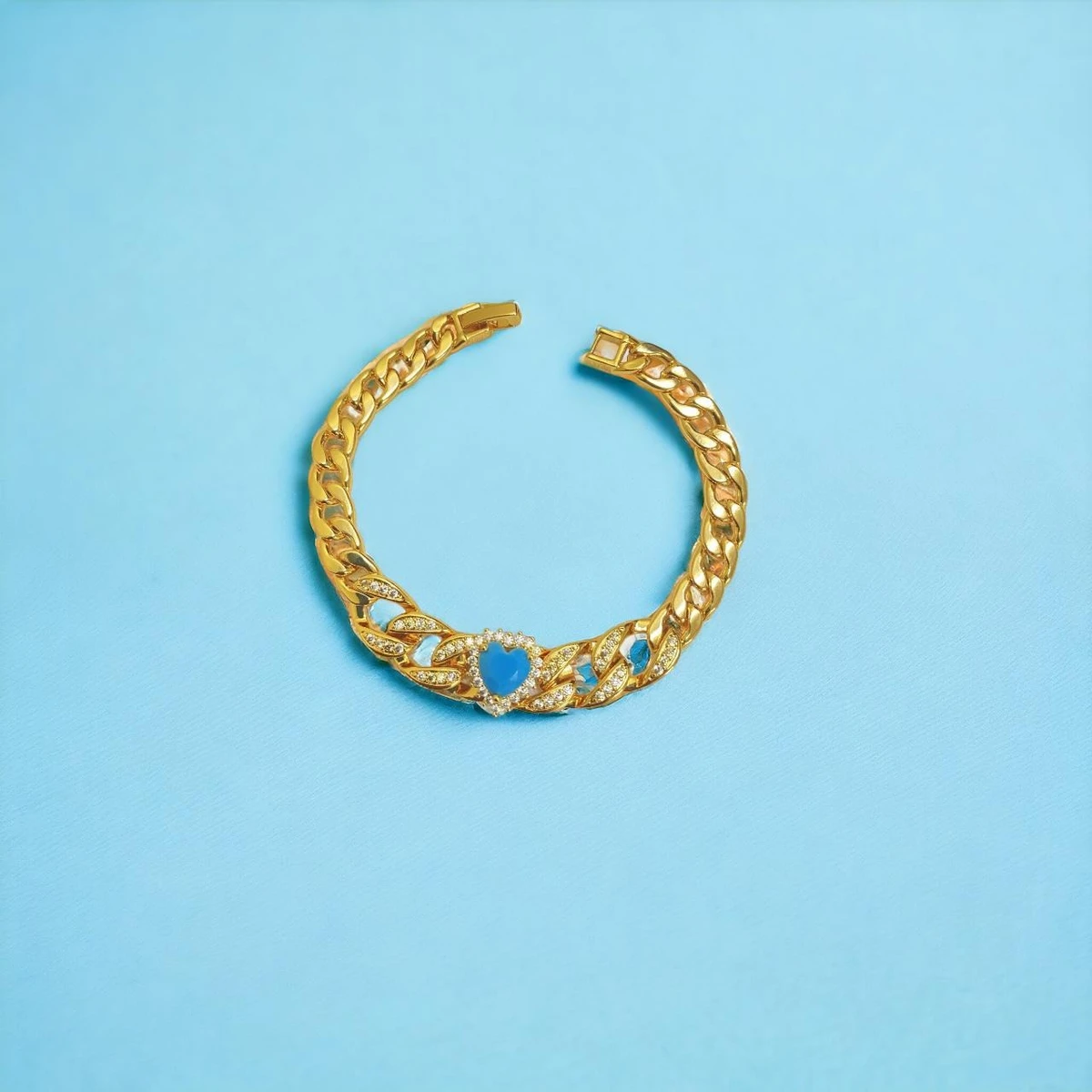 Golden Elegance: A Heartfelt Tribute - Bracelet Adorned with Interlinked Chains and a Stunning Blue Heart Gemstone Centerpiece