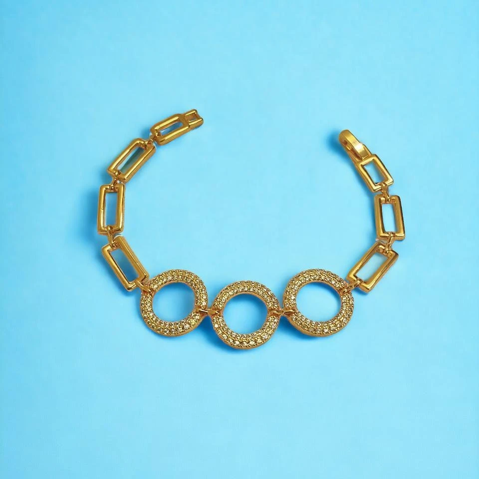 Exude Sophistication: A Luxurious Imitation Gold Bracelet with Delicate Rectangular Links and Intricately Designed Circular Charms