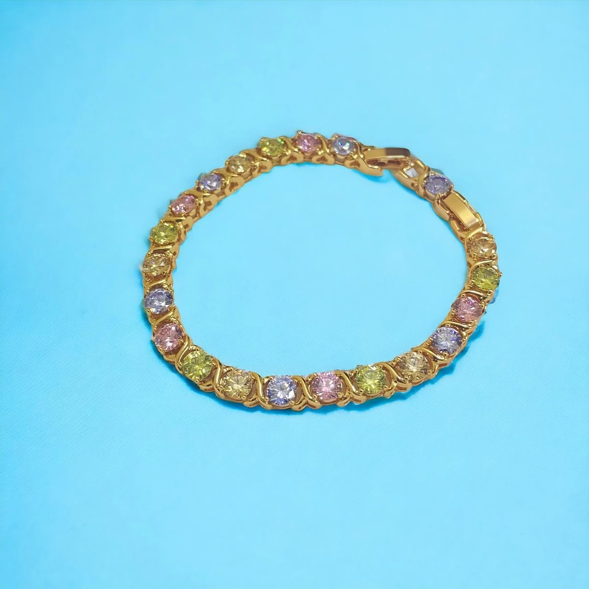 Radiant Spectrum: A Luxurious Bracelet Adorned with a Dazzling Array of Multicolored Gemstones Set in Elegant Gold