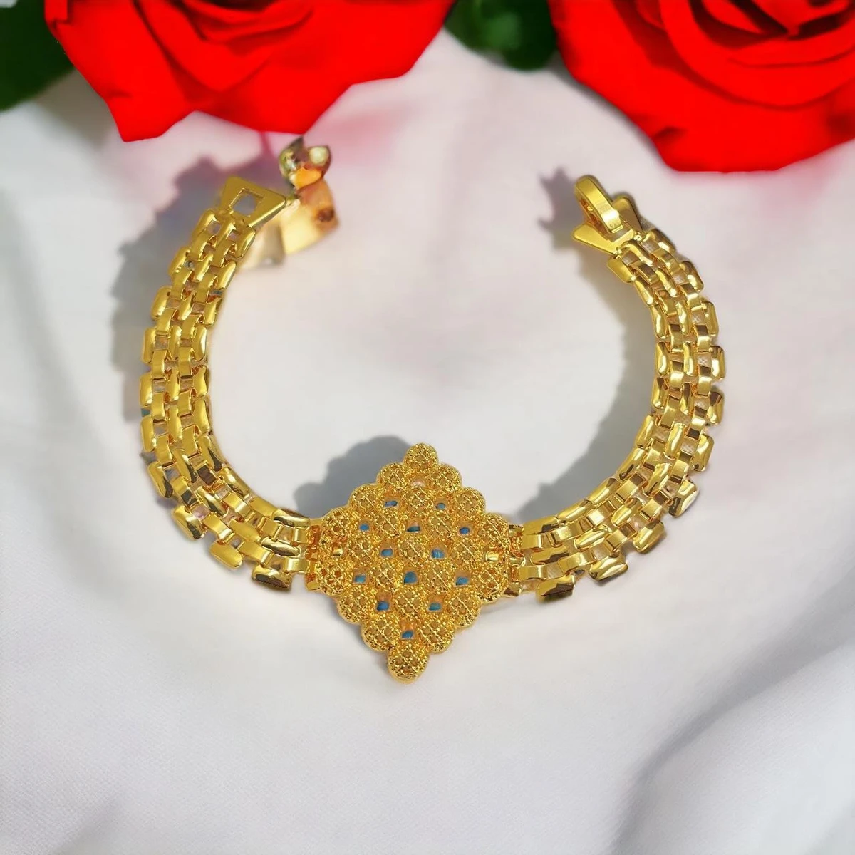 Radiant Majesty: A Dazzling Imitation Gold Bracelet with an Ornately Decorated Central Plaque, Exuding Opulence and Grandeur