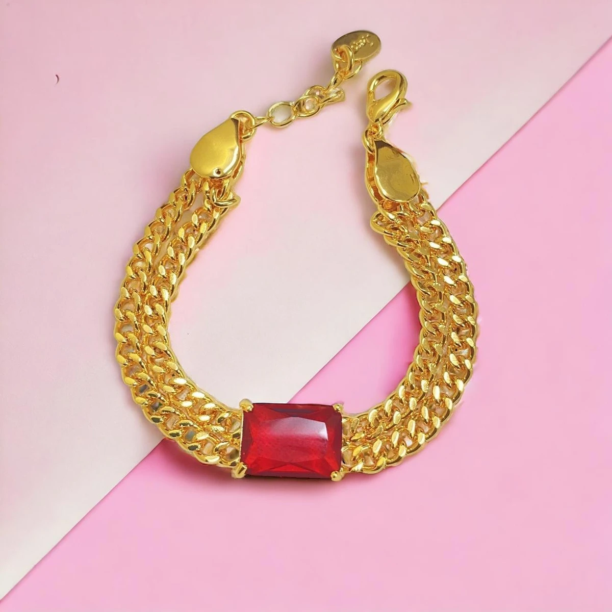 Regal Crimson: Opulent Imitation Gold Bracelet with Intricately Interwoven Chain and Rectangular Red Gemstone Centerpiece