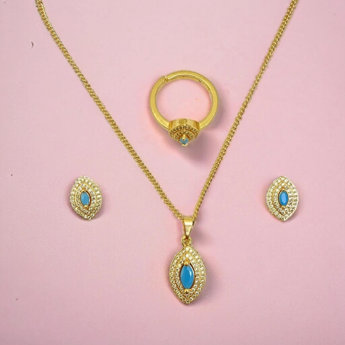 Jeweled Majesty: Opulent Gold Ensemble Bedecked with Vibrant Gemstones, Radiating Luxurious Elegance and Timeless Beauty