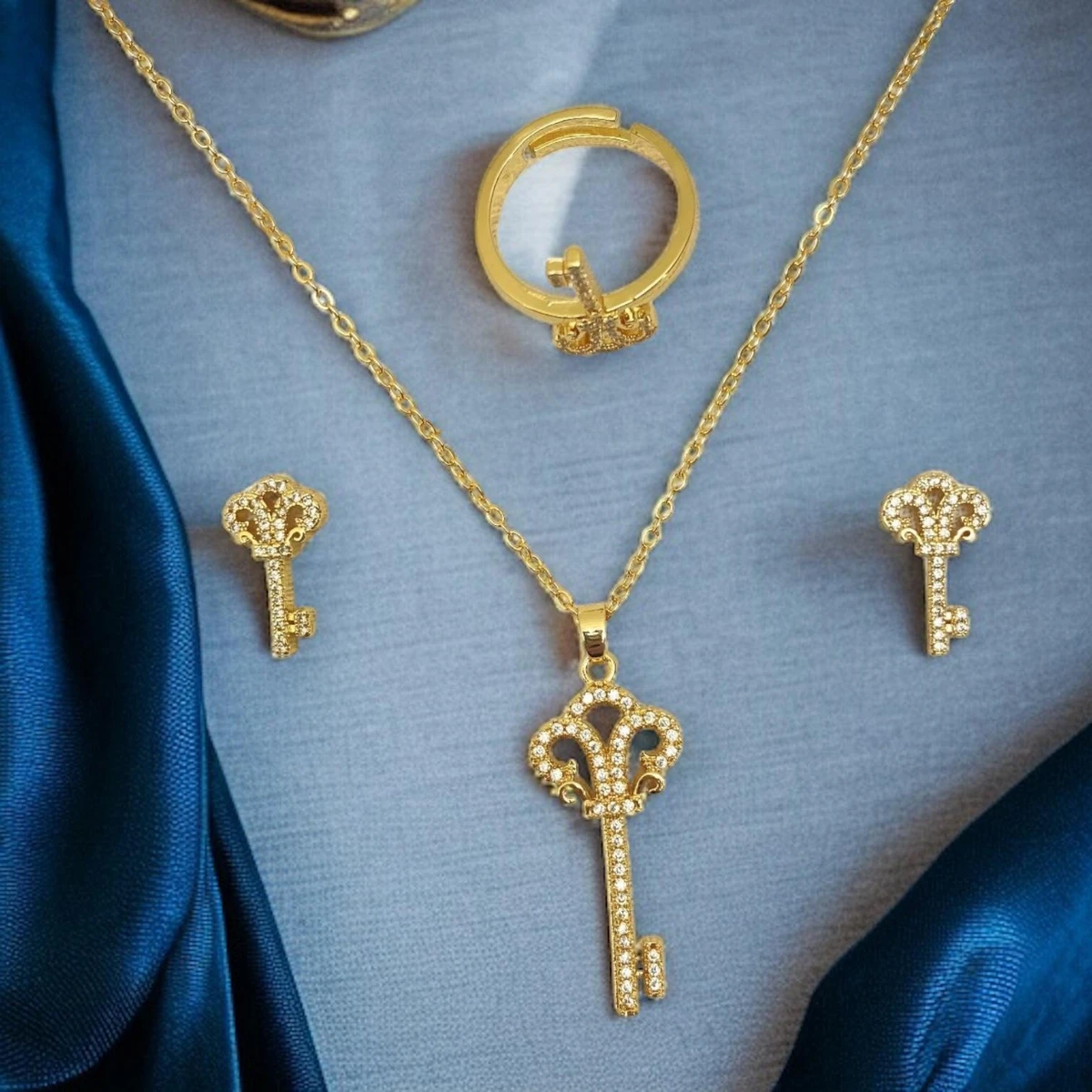 Keys to Luxury: Sophisticated Imitation Gold Jewelry Set Adorned with Intricate Designs and Embedded Stones
