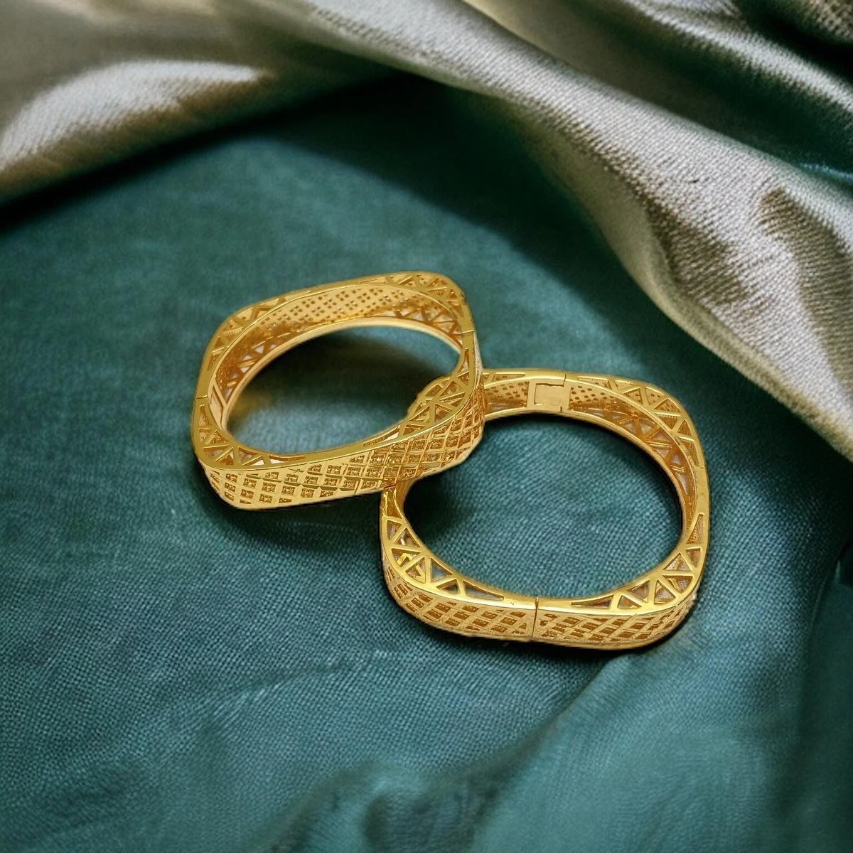 Ornate Opulence: Elegantly Crafted Pair of Intricate Golden Bangles, Radiating Regal Splendor and Timeless Beauty